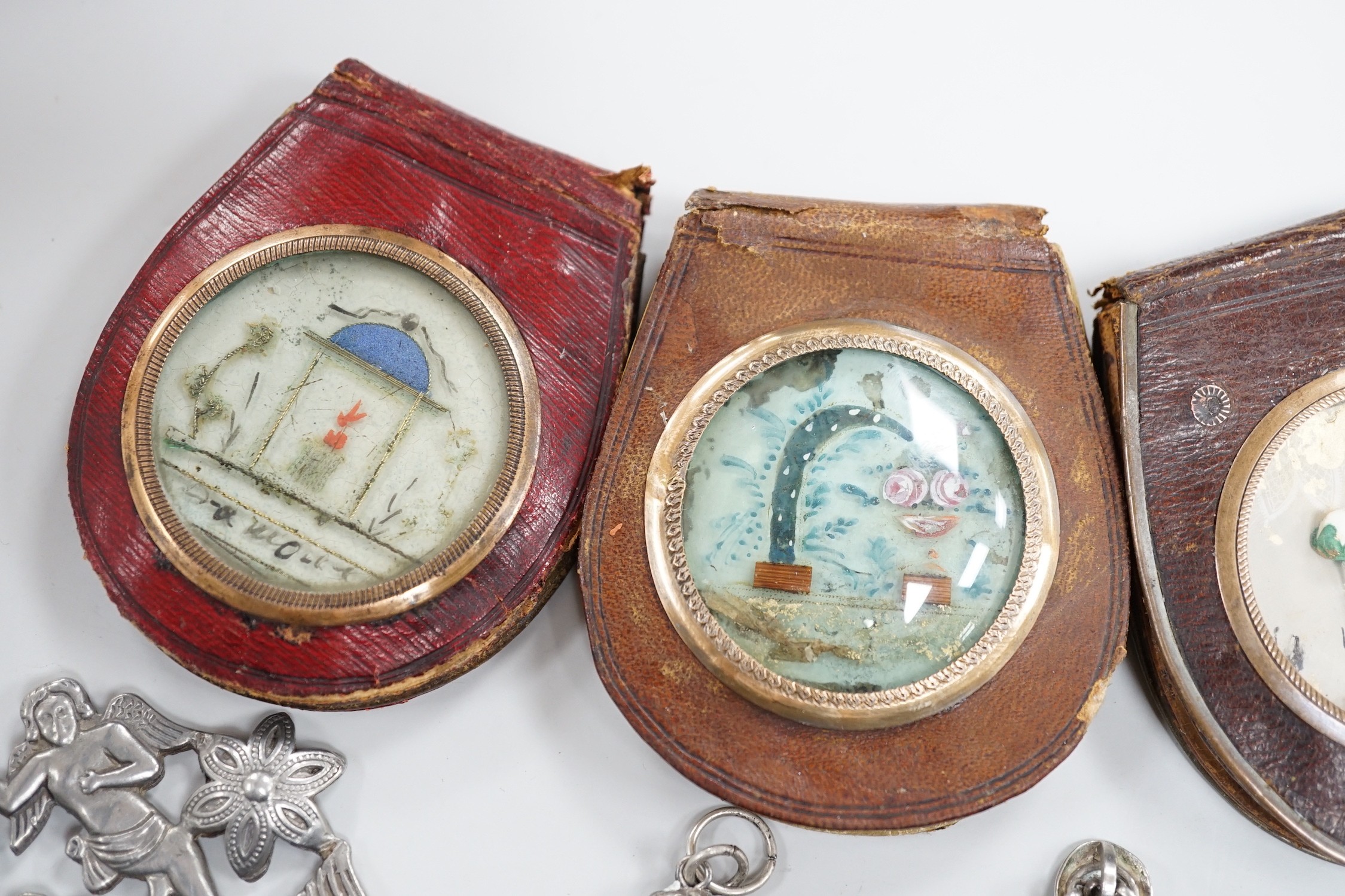 A group of catholic related collectables including Corpus Christi, rosary bead holders etc.